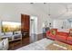 Well-lit living room features dark wood floors, a decorative fireplace, and access to other living spaces at 6057 Lake Pointe Dr # 408, Orlando, FL 32822