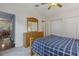 Spacious bedroom featuring a wooden dresser, two closets, and a ceiling fan at 6057 Lake Pointe Dr # 408, Orlando, FL 32822