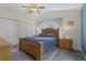 Comfortable main bedroom with vaulted ceiling, large window, and ample closet space at 6057 Lake Pointe Dr # 408, Orlando, FL 32822