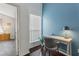 Bright office space featuring dark wood floors, a modern desk setup, and natural light perfect for productivity at 6057 Lake Pointe Dr # 408, Orlando, FL 32822