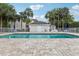 Enjoy the community pool, surrounded by lounge chairs and lush greenery, perfect for relaxation and recreation at 6057 Lake Pointe Dr # 408, Orlando, FL 32822