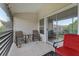 Enjoy serene outdoor living on this screened porch, a perfect spot for relaxation and picturesque views at 6057 Lake Pointe Dr # 408, Orlando, FL 32822