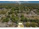 Overhead shot of a home and neighborhood surrounded by mature trees and green lawns at 633 E Church Ave, Longwood, FL 32750
