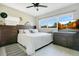 Comfortable bedroom with a large bed, wooden dressers, and ample natural light at 633 E Church Ave, Longwood, FL 32750