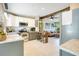Well-equipped kitchen with stainless steel appliances and a cozy seating area at 633 E Church Ave, Longwood, FL 32750