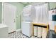 Convenient laundry room offers a stacked washer/dryer, utility sink, and ample storage space at 633 E Church Ave, Longwood, FL 32750