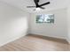 Bright bedroom with natural light, a ceiling fan, and light wood flooring at 7085 Willowwood St, Orlando, FL 32818
