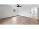 Spacious bedroom boasts two closets, light wood floors, and plenty of natural light at 7085 Willowwood St, Orlando, FL 32818