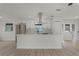 Beautiful kitchen with white cabinets, stainless steel appliances, central island, and modern design at 7085 Willowwood St, Orlando, FL 32818