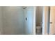 Contemporary bathroom with a glass-enclosed shower and separate toilet area at 7382 Sw 129Th Ln, Ocala, FL 34473