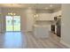 Bright, open kitchen with stainless steel appliances, an island, and easy access to the backyard at 7382 Sw 129Th Ln, Ocala, FL 34473