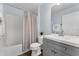 Clean bathroom with a shower-tub, vanity with modern sink, and neutral tones at 7998 Harbor Bend Cir, Orlando, FL 32822