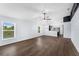 Spacious open-concept living room with modern finishes and abundant natural light from two large windows at 7998 Harbor Bend Cir, Orlando, FL 32822