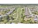 Aerial view shows the golf course and surrounding homes at 8413 Sw 54Th Loop, Ocala, FL 34481