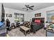 Cozy bedroom with ceiling fan, carpet and view to window at 8413 Sw 54Th Loop, Ocala, FL 34481