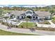 A beautiful community clubhouse boasts outdoor dining, bocce ball, and cornhole in a park-like setting at 8413 Sw 54Th Loop, Ocala, FL 34481