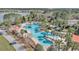 A stunning aerial view of the community pool surrounded by palm trees and lounge areas at 8413 Sw 54Th Loop, Ocala, FL 34481