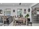 Open-concept dining area with table, bench, and view into the living room at 8413 Sw 54Th Loop, Ocala, FL 34481