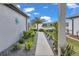 Inviting walkway with desert landscaping leading to the front entrance of this charming home at 8413 Sw 54Th Loop, Ocala, FL 34481