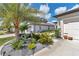 Attractive landscaping featuring plants and decorative rock beds leading to a well-maintained home at 8413 Sw 54Th Loop, Ocala, FL 34481