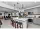 Stylish kitchen with island seating, stainless appliances, and open view to dining area at 8413 Sw 54Th Loop, Ocala, FL 34481