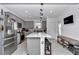 Clean kitchen with gray cabinetry, stainless steel appliances, and center island at 8413 Sw 54Th Loop, Ocala, FL 34481