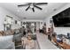 Bright living room with an open floor plan, seamlessly connecting to the dining and kitchen areas at 8413 Sw 54Th Loop, Ocala, FL 34481