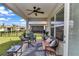 Inviting patio area with outdoor seating and a view of the landscaped backyard at 8413 Sw 54Th Loop, Ocala, FL 34481