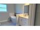 Bathroom featuring a modern soaking tub, a gray tiled floor, and a vanity at 851 Marion Oaks Mnr, Ocala, FL 34473