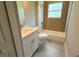 This bathroom features a tub with tiled walls, a toilet, and a stylish vanity with modern fixtures at 851 Marion Oaks Mnr, Ocala, FL 34473