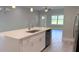 Open-concept kitchen featuring a center island with a sink, stainless steel appliances, and ample counter space at 851 Marion Oaks Mnr, Ocala, FL 34473