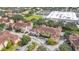 Aerial view of a residential neighborhood with multiple buildings, landscaping and parking at 12220 Wild Iris Way # 103, Orlando, FL 32837