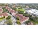 Aerial view of a residential neighborhood with multiple buildings, landscaping and parking at 12220 Wild Iris Way # 103, Orlando, FL 32837