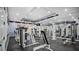 Well-equipped community gym with various weight machines and mirrored walls for a complete workout at 12220 Wild Iris Way # 103, Orlando, FL 32837