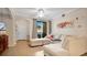 Bright living room featuring neutral tones, wood flooring, and access to a screened patio at 12220 Wild Iris Way # 103, Orlando, FL 32837