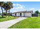 Charming single-story home with well-maintained lawn and updated exterior at 123 Tuxpan Ln, Kissimmee, FL 34743