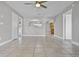 Open-concept living room with tile flooring, natural light, and an arched room divider at 123 Tuxpan Ln, Kissimmee, FL 34743