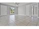 Spacious living room with tile flooring, abundant natural light, and neutral paint at 123 Tuxpan Ln, Kissimmee, FL 34743