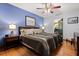 Relaxing bedroom with hardwood floors, a comfortable bed, and elegant decor at 1247 Rosemary Dr, Orlando, FL 32807