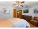 Bedroom featuring hardwood floors, a ceiling fan, and ample closet space at 1247 Rosemary Dr, Orlando, FL 32807