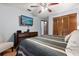Bedroom with hardwood floors, a ceiling fan, and a modern television at 1247 Rosemary Dr, Orlando, FL 32807