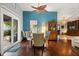 Cozy dining area adjacent to the kitchen with hardwood floors, modern chairs, and natural light at 1247 Rosemary Dr, Orlando, FL 32807
