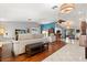 Open-concept living room showcasing unique flooring design, modern seating, and neutral wall color at 1247 Rosemary Dr, Orlando, FL 32807