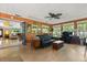 Cozy living room with lots of natural light, comfortable furniture and access to multiple rooms at 1247 Rosemary Dr, Orlando, FL 32807