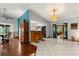 Open living space featuring a bar, a glimpse into the kitchen, and easy access to other rooms at 1247 Rosemary Dr, Orlando, FL 32807