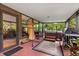 Enclosed patio featuring a hot tub, grill, and tropical plants for relaxation at 1247 Rosemary Dr, Orlando, FL 32807