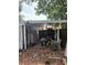 Carport with items and tools on the ground at 128 N Sunland Dr, Sanford, FL 32773