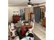 Cozy dining room featuring a ceiling fan, a sliding glass door, and an adjacent kitchen at 128 N Sunland Dr, Sanford, FL 32773