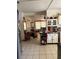 Open kitchen featuring tile flooring, ample countertop space, and seamless connection to living areas at 128 N Sunland Dr, Sanford, FL 32773