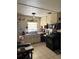 Functional kitchen featuring a gas range, built-in microwave, and ample countertop space at 128 N Sunland Dr, Sanford, FL 32773